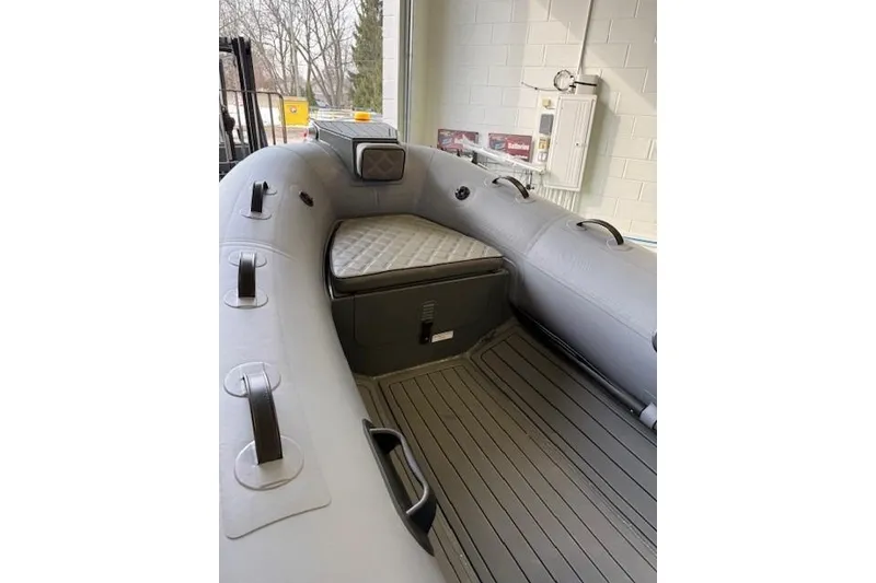 Slide: The Image of Inflatable boat interior, Desner CL 360 FCT, 2026 model, with cushioned seating and handles. - 11