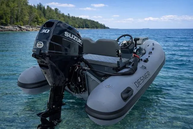 Slide: The Image of Inflatable boat Desner CL 360 FCT 2026 with Suzuki motor on clear blue water. - 4