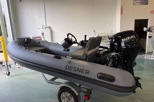 Slide: The Image of Inflatable Desner CL 360 FCT boat with Suzuki motor on trailer, 2026 model. - 8
