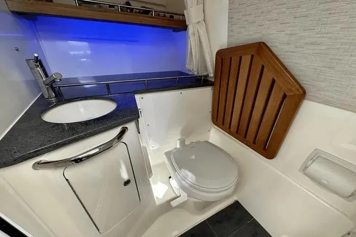 Slide: The Image of Luxurious 2019 Boston Whaler 350 Realm boat bathroom with modern amenities and sleek design. - 9