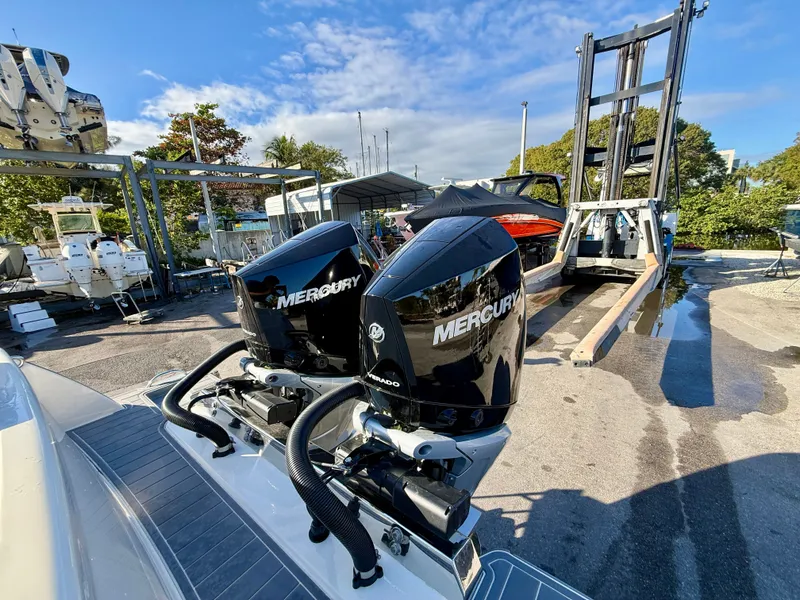Slide: The Image of Scout 288 LXF 2026 with Mercury engines at a boatyard. - 10