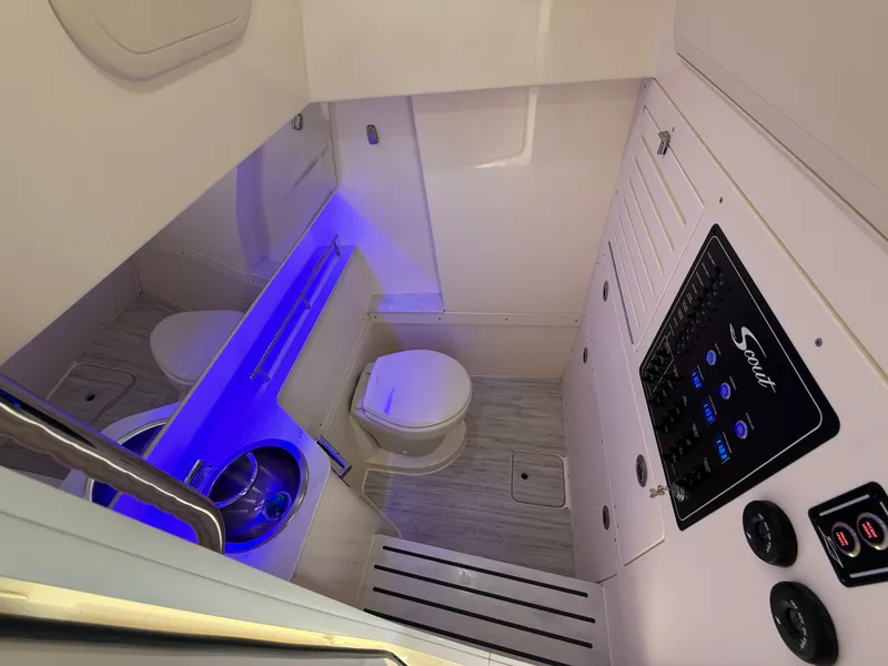 Slide: The Image of Interior of 2026 Scout 288 LXF featuring toilet and control panel. - 12