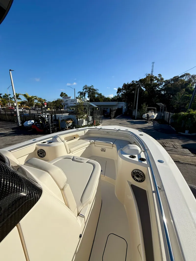 Slide: The Image of Scout 288 LXF 2026 boat with luxurious interior and blue sky. - 3