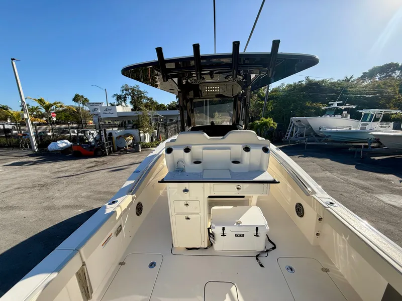 Slide: The Image of Scout 288 LXF 2026 boat with modern features outdoors. - 7