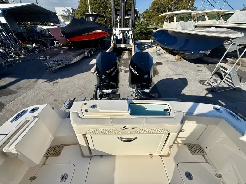 Slide: The Image of Scout 288 LXF 2026 with twin Mercury engines at dock. - 9