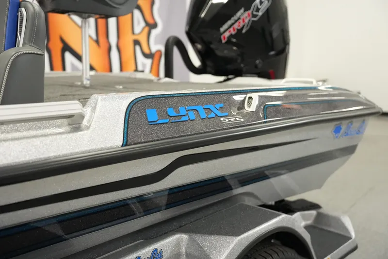 The Image of 2026 Bass Cat Lynx STS boat, sleek design with blue accents and modern features. - 0