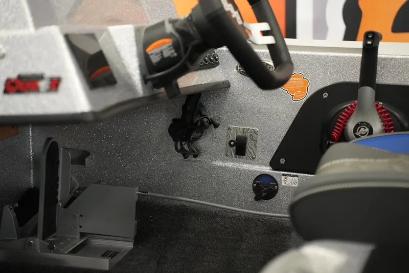 Slide: The Image of Interior view of 2026 Bass Cat Lynx STS boat cockpit with steering wheel and controls. - 10