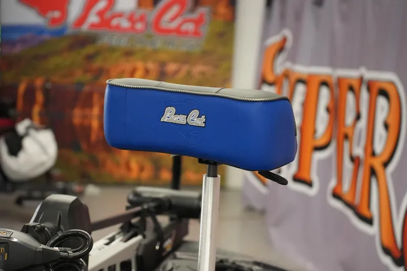 Slide: The Image of 2026 Bass Cat Lynx STS boat seat with blue upholstery and logo detail. - 12