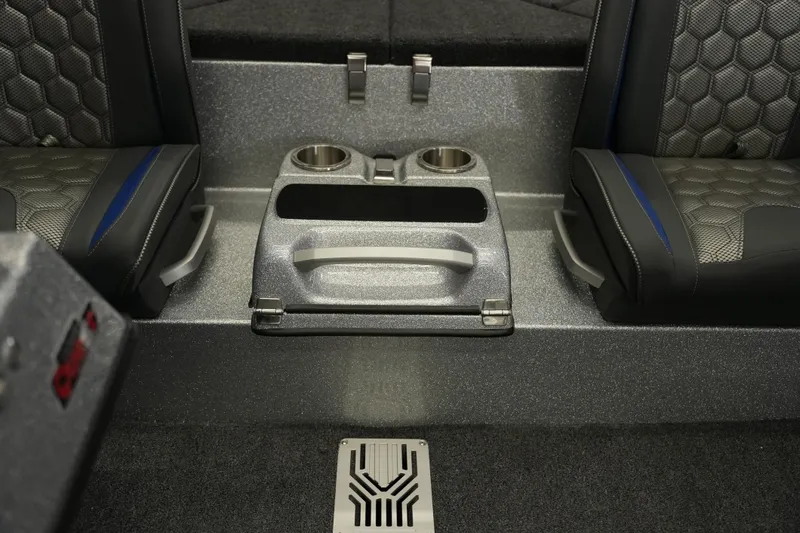 Slide: The Image of 2026 Bass Cat Lynx STS interior with cup holders and hexagonal seat pattern. - 16