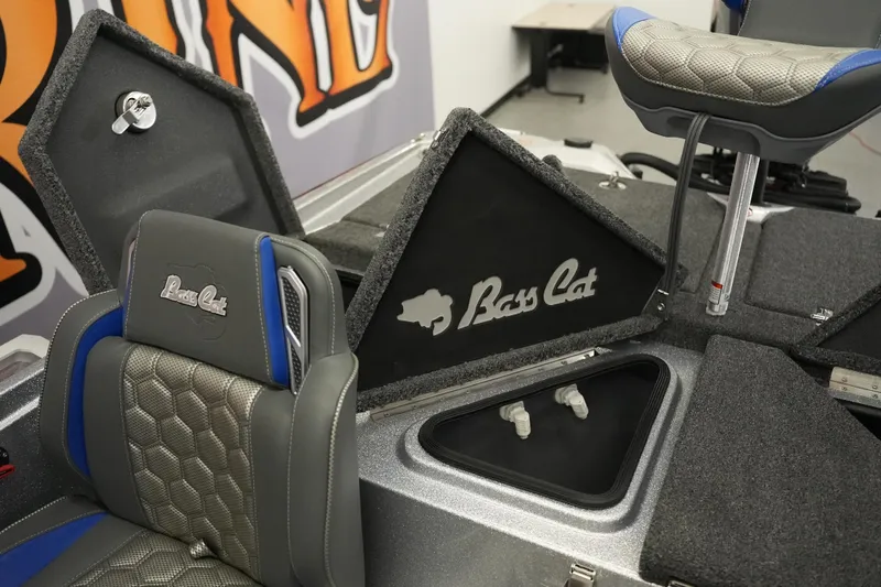 Slide: The Image of 2026 Bass Cat Lynx STS boat interior with logo and seating details. - 25