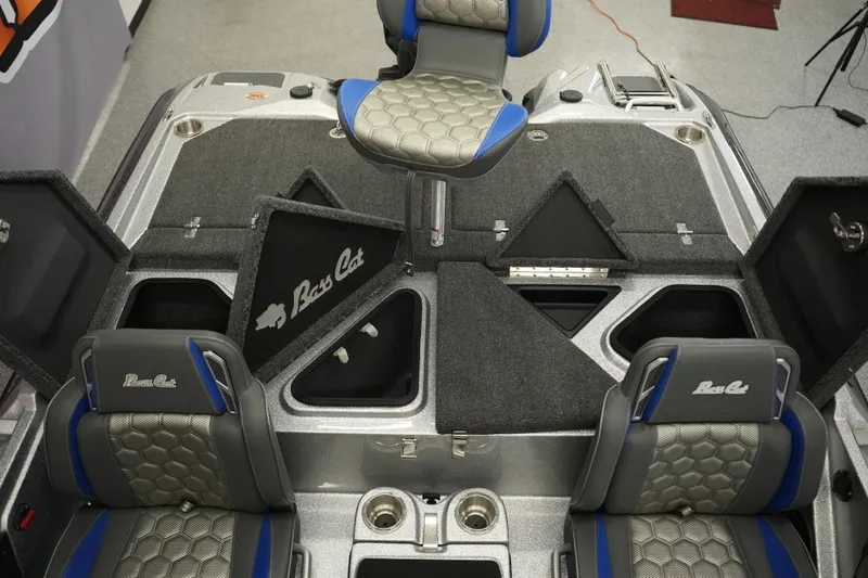 Slide: The Image of 2026 Bass Cat Lynx STS boat interior with storage compartments and seating. - 28