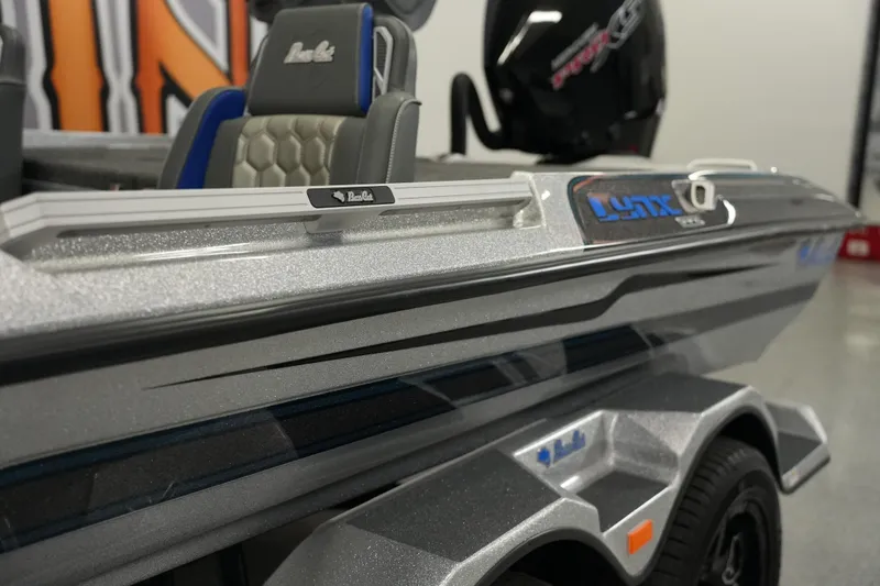 Slide: The Image of 2026 Bass Cat Lynx STS boat with sleek design and modern features. - 4