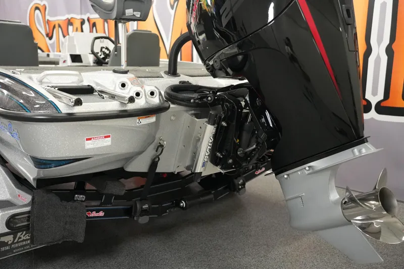 Slide: The Image of 2026 Bass Cat Lynx STS boat with powerful outboard motor, detailed rear view. - 5