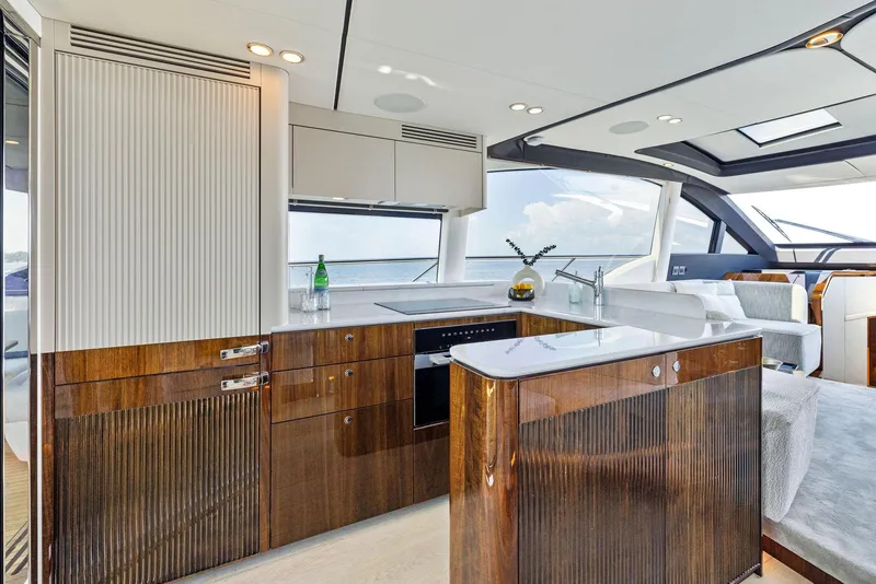 Slide: The Image of Luxurious interior of 2024 Fairline Phantom 65 yacht with modern kitchen design. - 11