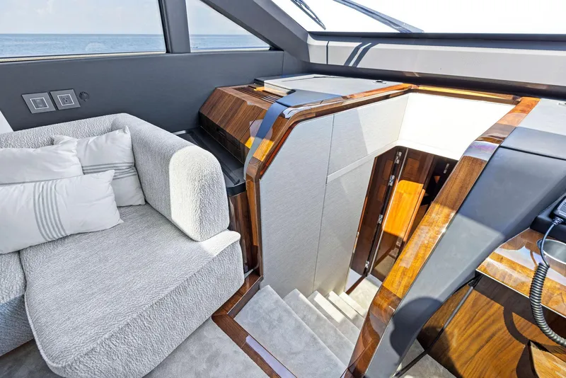 Slide: The Image of Luxurious interior of 2024 Fairline Phantom 65 yacht with plush seating and elegant wood finishes. - 18