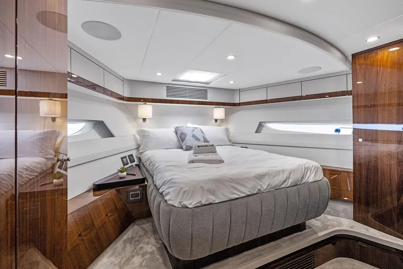 Slide: The Image of Luxurious bedroom interior of 2024 Fairline Phantom 65 yacht with modern design and elegant furnishings. - 19