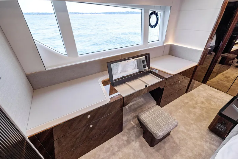 Slide: The Image of Luxurious interior of 2024 Fairline Phantom 65 yacht with elegant vanity and sea view. - 38