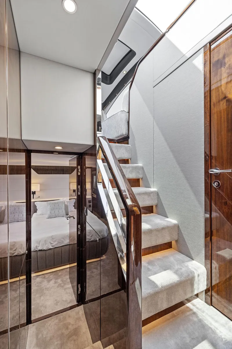 Slide: The Image of Luxurious interior of 2024 Fairline Phantom 65 yacht with elegant staircase and modern design. - 45