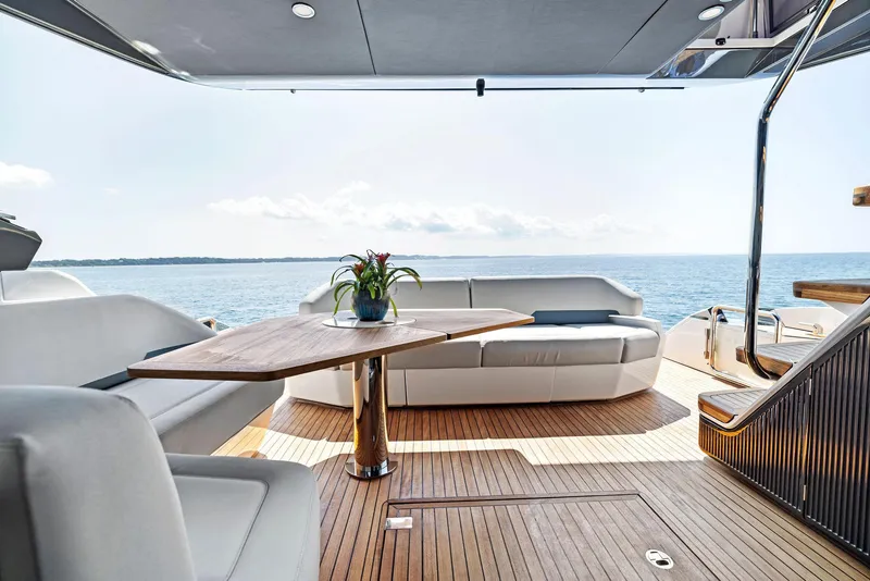 Slide: The Image of Luxurious 2024 Fairline Phantom 65 yacht interior with elegant seating and ocean view. - 49