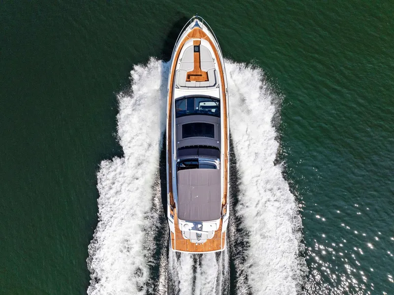 Slide: The Image of Aerial view of 2024 Fairline Phantom 65 yacht cruising on open water. - 6