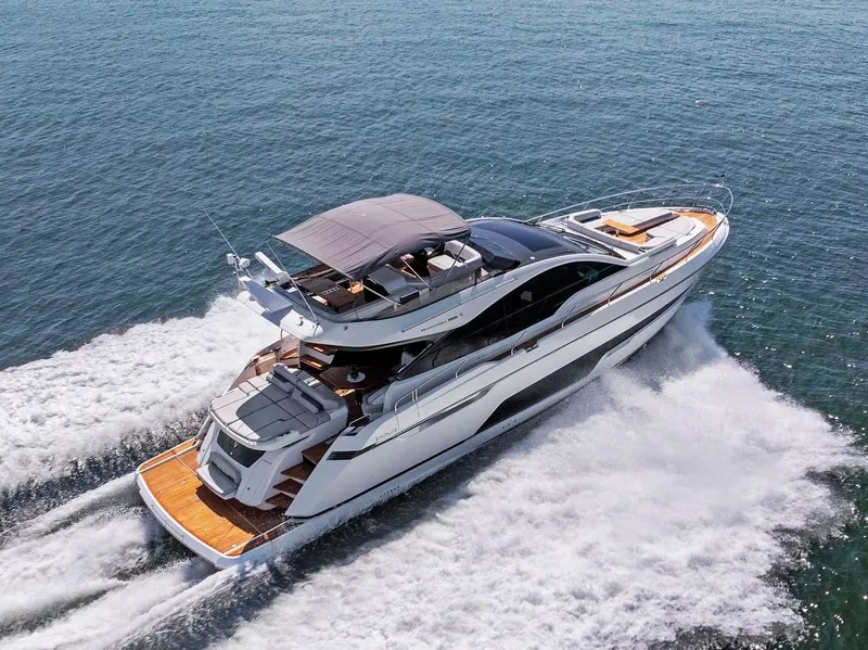 Slide: The Image of 2024 Fairline Phantom 65 yacht cruising on open water, showcasing sleek design and luxury features. - 7
