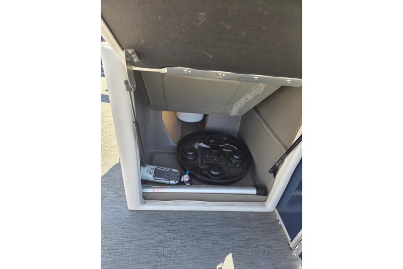 Slide: The Image of Storage compartment of 2021 Godfrey Sweetwater 1880 FX boat, featuring equipment and accessories. - 10