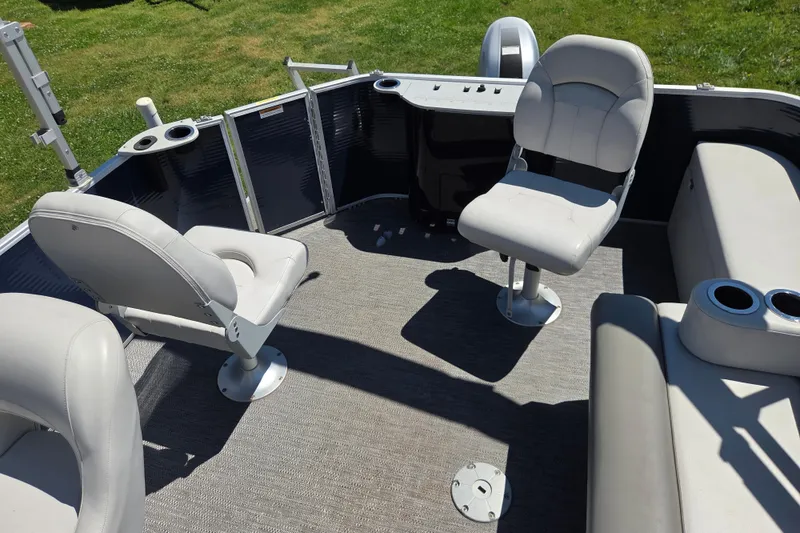 Slide: The Image of Interior of 2021 Godfrey Sweetwater 1880 FX pontoon boat with seating and cup holders. - 15