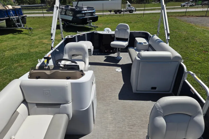 Slide: The Image of 2021 Godfrey Sweetwater 1880 FX pontoon boat interior with seating and steering console. - 16