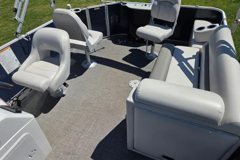 Slide: The Image of Interior of 2021 Godfrey Sweetwater 1880 FX pontoon boat with seating and cup holders. - 6