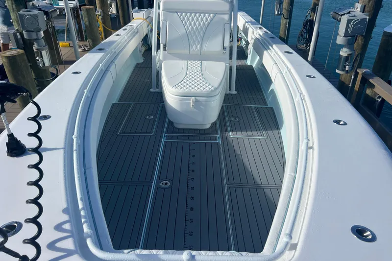 Slide: The Image of 2024 Contender 35 ST boat deck with sleek seating and modern design. - 13