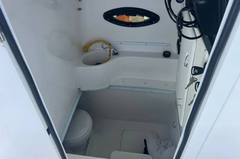 Slide: The Image of 2024 Contender 35 ST boat interior with compact bathroom and sink. - 19