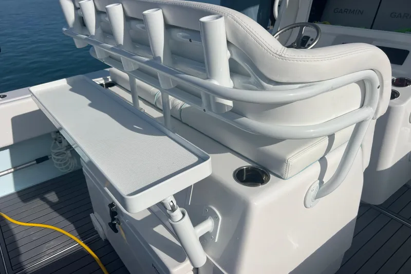 Slide: The Image of 2024 Contender 35 ST boat interior with rod holders and seating. - 21