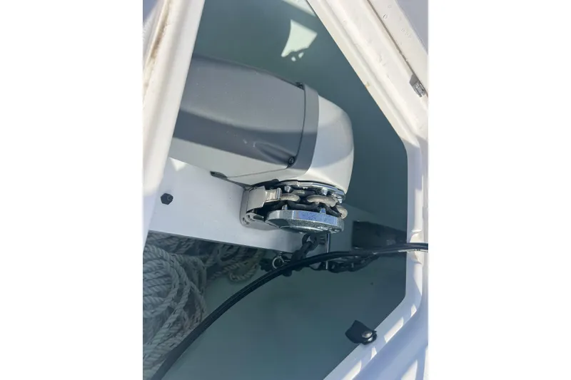 Slide: The Image of Anchor winch system on 2024 Contender 35 ST boat, featuring ropes and chains. - 23