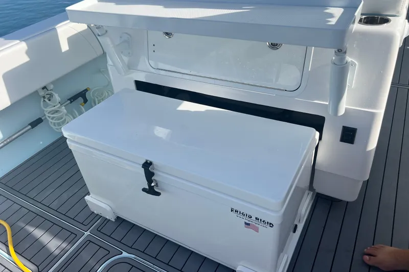 Slide: The Image of 2024 Contender 35 ST boat deck with Frigid Rigid cooler and storage area. - 24