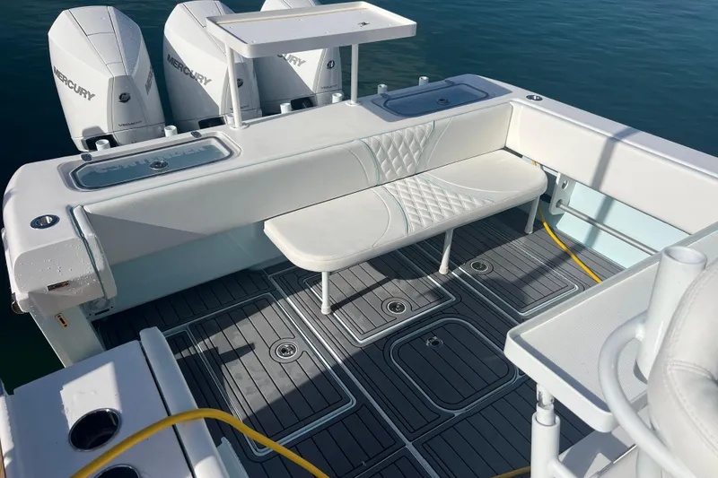 Slide: The Image of 2024 Contender 35 ST boat deck with seating and Mercury engines. - 25