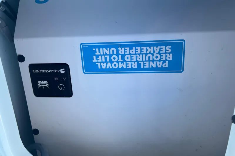 Slide: The Image of 2024 Contender 35 ST boat panel with Seakeeper lift unit instructions. - 27