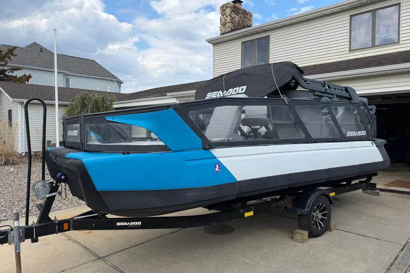 Slide: The Image of 2022 Sea-Doo Switch Cruise 21 on trailer, parked in residential driveway. - 6
