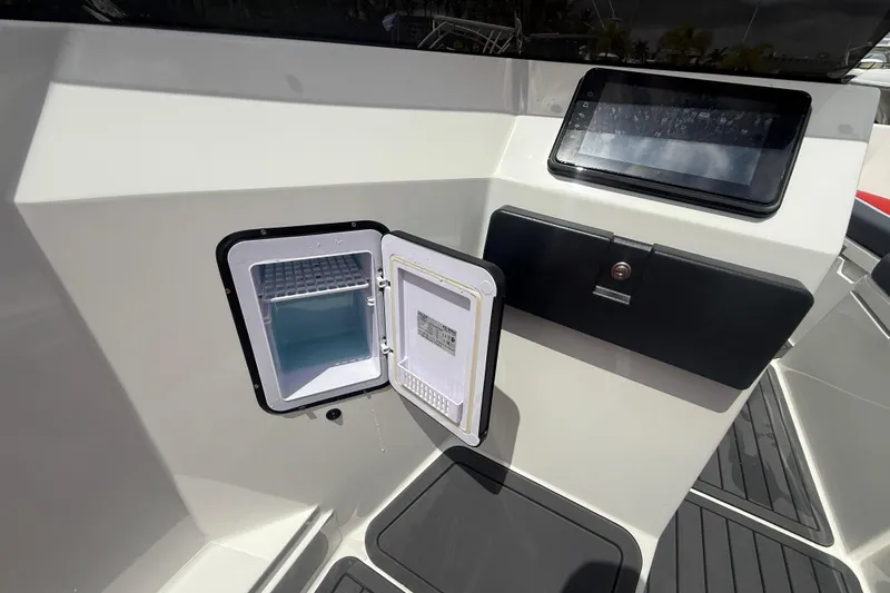 Slide: The Image of Open compartment on Custom DW DESIGN 570BR boat, showcasing interior storage space. - 14