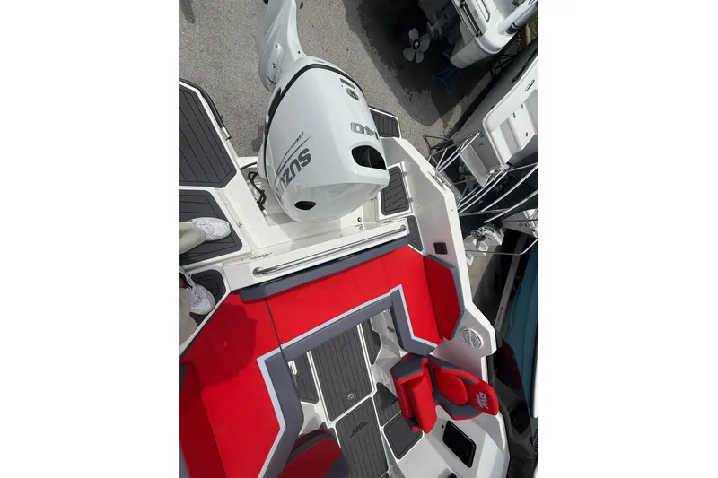 Slide: The Image of Red and gray interior of 2025 Custom DW DESIGN 570BR boat with Suzuki engine. - 18