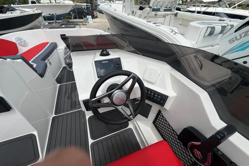 Slide: The Image of Custom DW DESIGN 570BR 2025 boat cockpit with steering wheel and navigation system. - 19
