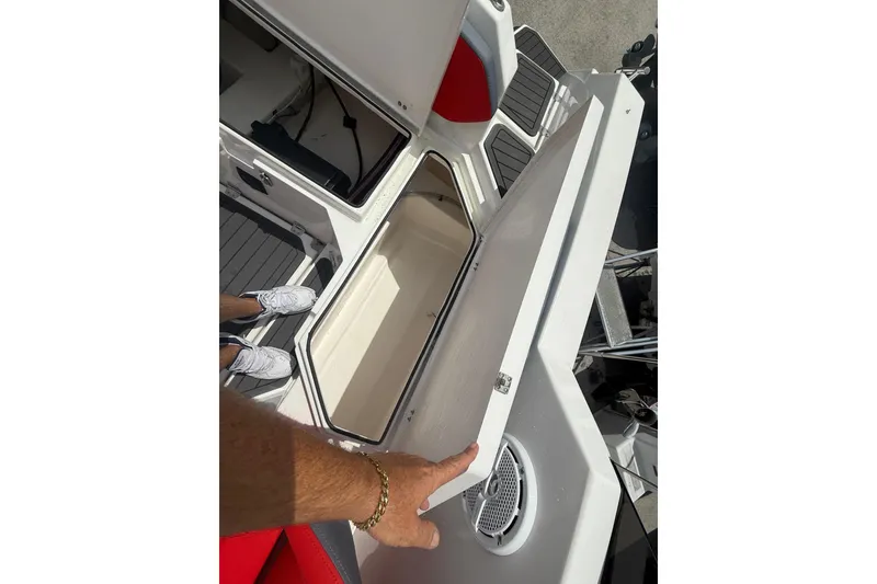 Slide: The Image of Open storage compartment on 2025 Custom DW DESIGN 570BR boat deck. - 20