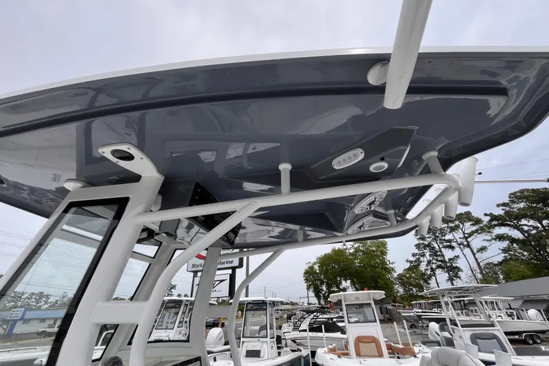 Slide: The Image of 2026 Tidewater 282 CC Adventure boat with sleek T-top design and modern features. - 12