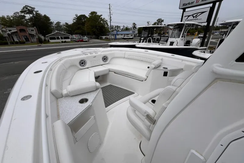 Slide: The Image of 2026 Tidewater 282 CC Adventure boat interior with white seating and modern design. - 13