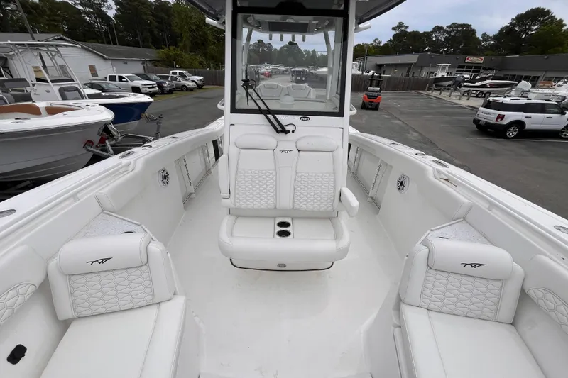 Slide: The Image of 2026 Tidewater 282 CC Adventure boat interior with white seating and modern design. - 15