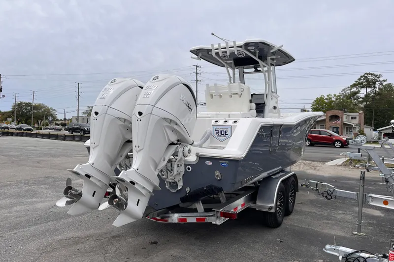Slide: The Image of 2026 Tidewater 282 CC Adventure boat with dual Yamaha engines on a trailer. - 5
