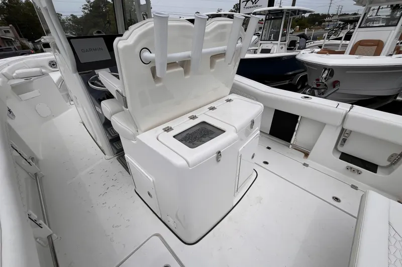 Slide: The Image of 2026 Tidewater 282 CC Adventure boat interior with Garmin display and storage compartments. - 8