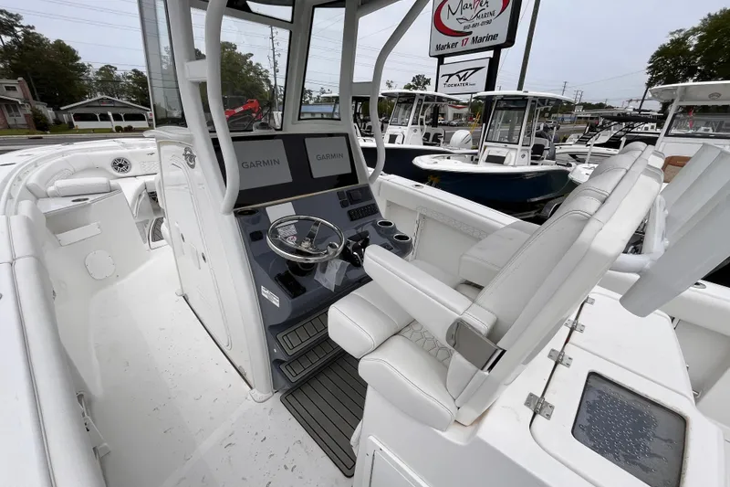 Slide: The Image of 2026 Tidewater 282 CC Adventure boat interior with Garmin navigation system. - 9