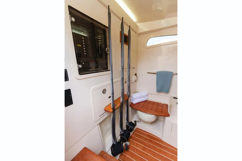 Slide: The Image of Manufacturer Provided Image: 2021 Grady-White Canyon 336 cabin interior with fishing rod storage and marine toilet. - 14