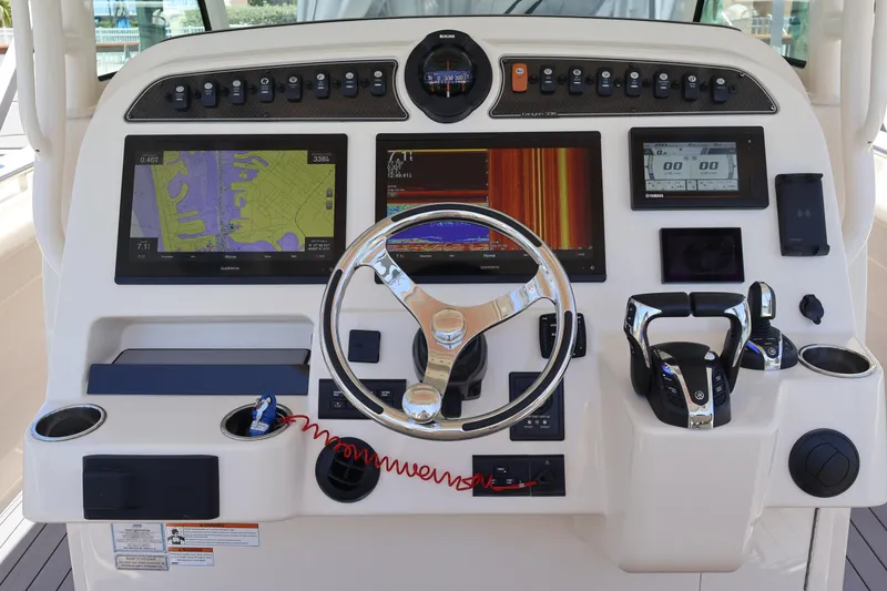 Slide: The Image of Control panel of 2021 Grady-White Canyon 336 boat with advanced navigation systems. - 22