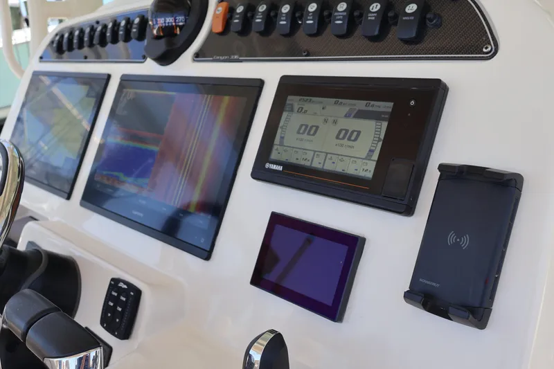 Slide: The Image of Control panel of 2021 Grady-White Canyon 336 boat with advanced navigation displays. - 25